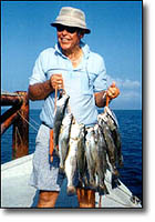 texas saltwater fishing is the best! fisherman poses with his trout.